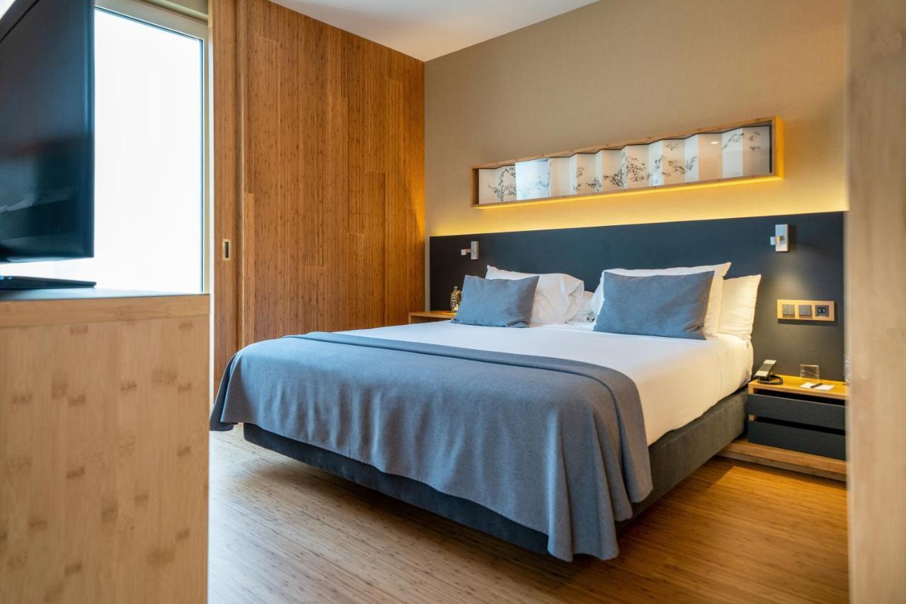 Eurostars Barcelona Central Exterior photo A bedroom at the hotel